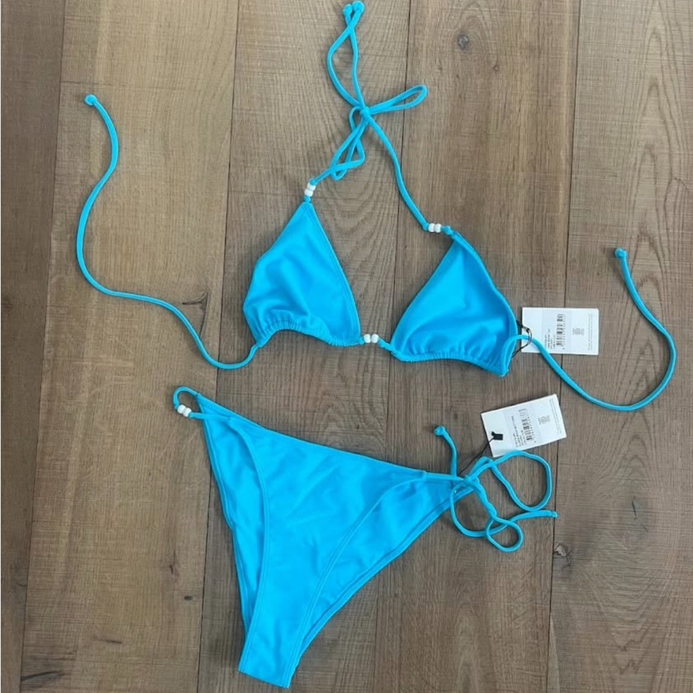 Lovers + Friends bright blue bikini with bead details.